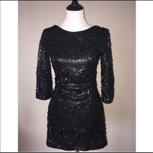 Backless open back sequin dress.